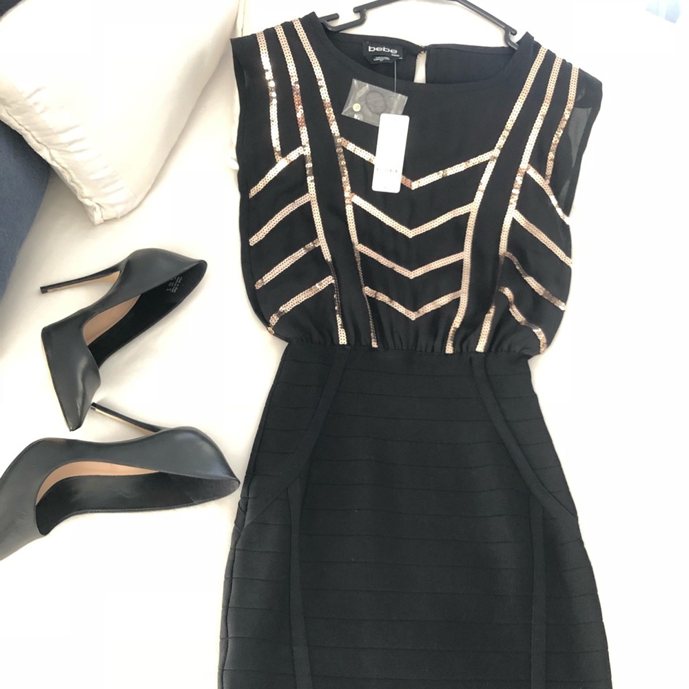 Black and Gold BeBe Dress, both Sheek yet Sexy.